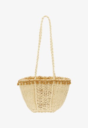 Vævet stråkurv i en naturlig beige farve, designet med et flettet håndtag og en dekorativ frynse af pom-poms langs den øverste kant.