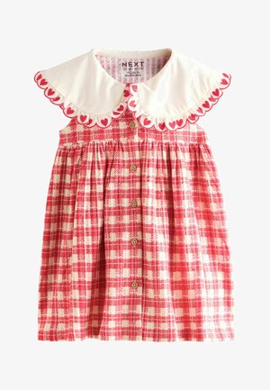 Piros és fehér kockás ruha fehér gallérral, szívformákkal, elöl gombokkal és ráncolt derékkal. Pamutból készült.