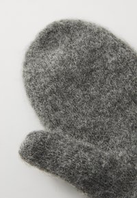 Gray woolen mitten with a soft, fuzzy texture, rounded tip, and a solid, seamless design. The color is a mix of dark and light gray fibers.