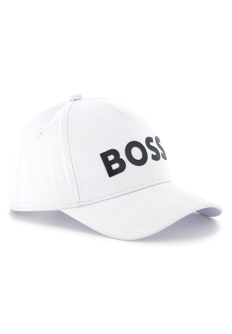 White baseball cap made of fabric, featuring a black "BOSS" logo on the front, curved brim, and adjustable strap at the back.