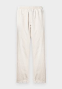 Ανοιχτό μπεζ παντελόνι με ελαστική μέση, ίσια γραμμή και απαλό βαμβακερό ύφασμα. Απλός, χωρίς στολίδια σχεδιασμός.