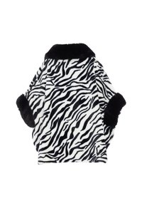 Fekete-fehér zebra mintás műszőrme kabát. Fekete gallérral és mandzsettákkal rendelkezik, puha tapintású és laza szabású.