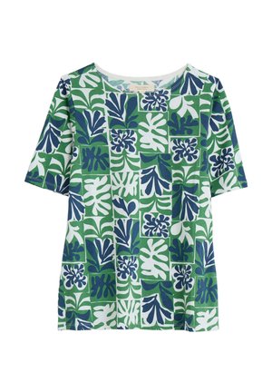 Short-sleeve top featuring a green fabric with white and navy floral patterns, rectangular shapes, and a round neckline.