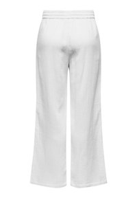 White, wide-leg trousers made from textured fabric with an elastic waistband and no visible fastenings. Clean lines and minimalist design.