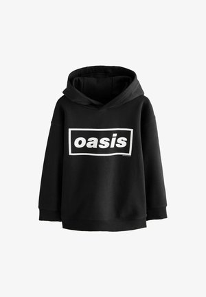 Sweatshirt à capuche noire en tissu doux, avec un grand logo "oasis" blanc en design rectangulaire sur le devant.