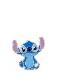 Épingle émaillée représentant un personnage de dessin animé bleu aux grands yeux, avec des accents violets sur les oreilles, une forme corporelle ronde, et un petit détail en cristal. Contour argenté.