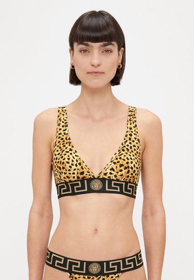 Bralet din material cu imprimeu de leopard, cu decolteu adânc în V și bandă groasă neagră ce prezintă un logo auriu și un model cu chei grecesti. Material moale, elastic.