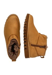 Brune l�æder ankelstøvler med pelsforing og lynlås i siden. Har en tekstureret gummisål med udsparinger og et rundt tådesign.