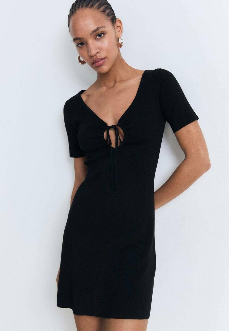 Black ribbed mini dress with short sleeves and a deep V-neck featuring a central tie detail, crafted from a soft stretch material.