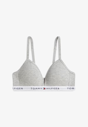 Sujetador gris con copas suaves, tirantes ajustables y banda elástica blanca con el logo y el emblema de la bandera de Tommy Hilfiger.