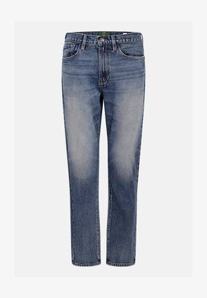 Jeans de ganga azul com corte reto, detalhes desbotados, cinco bolsos e fecho de botão. Apresenta uma etiqueta verde dentro da cintura.