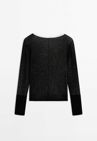 Top noir transparent à manches longues avec des poignets noirs unis et un large décolleté, présenté à plat avec le dos face vers le haut sur un fond blanc.