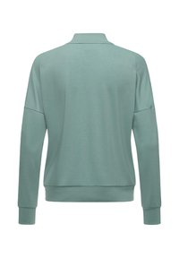 Sudadera verde menta con cuello alto, hombros caídos y puños de canalé. Tejido suave con un corte relajado y diseño de color sólido.