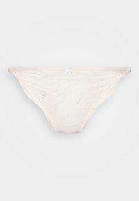 Lace thong in ivory, featuring floral embroidery, scalloped edges, and a sheer texture. Slim straps and delicate detailing throughout.