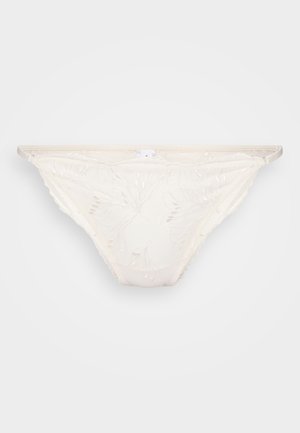 Siteit thongs vaale in ivory, yenye sura ya maua, mipaka myembamba, na muonekano wa uwazi. Mishtuko midogo na maelezo ya kifahari kila mahali.