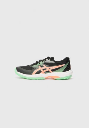 Black athletic shoe with mesh and synthetic upper, green sole, pink accents, and a lightweight design. Features a secure lace closure.
