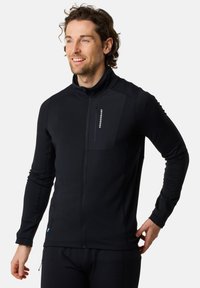 Black zip-up fleece jacket with a high collar, featuring a textured body, a chest pocket, and a logo on the left side. Smooth fabric finish.