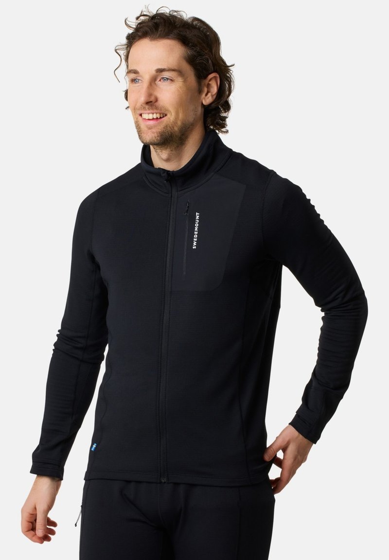 Black zip-up fleece jacket with a high collar, featuring a textured body, a chest pocket, and a logo on the left side. Smooth fabric finish.