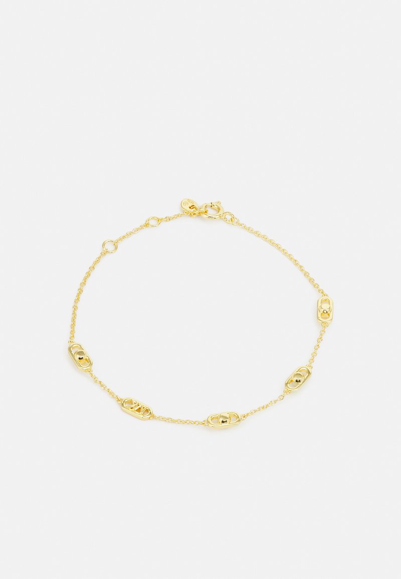 Pulsera de oro con una delicada cadena de eslabones ovalados y pequeños acentos esféricos. Cierre de broche en un extremo. Textura suave.