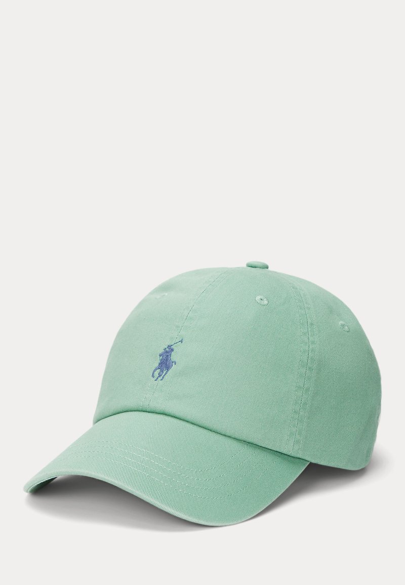 Light green cotton baseball cap with a curved brim, embroidered purple logo on the front, and six eyelets for ventilation.