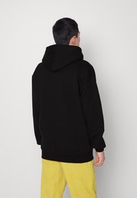 Puma HOODIE - Felpa con cappuccio - black