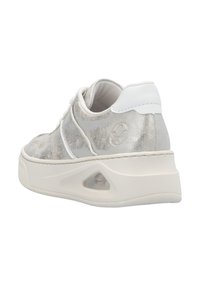 Light gray sneaker with shiny metallic upper, white accents, rounded shape, textured surface, and a visible air cushioning feature in the sole.