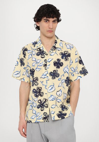 Short-sleeve, yellow button-up shirt featuring a floral pattern in dark blue and light blue, made from lightweight fabric with a relaxed fit.