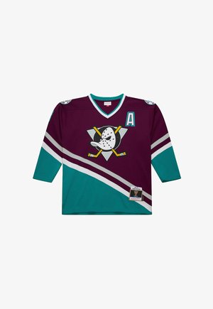 Hockey-Trikot in kastanienbraun und türkisfarben, mit einem Logo von gekreuzten Hockeyschlägern und einer Maske, weißen Streifen und einem "A" auf der Brust.