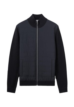 Veste noire zippée avec devant matelassé, col montant côtelé et manches et ourlet en tricot côtelé.
