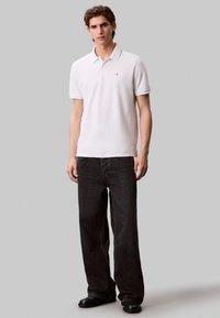 Calvin Klein Jeans Polo shirt - blanc de blanc