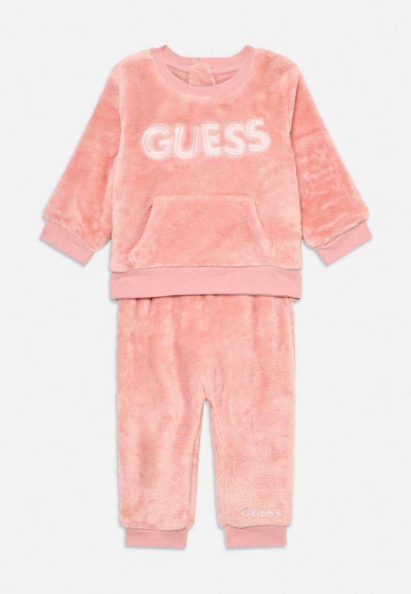 Set di felpa rosa in due pezzi, composto da un sweatshirt con colletto a giro e tasca frontale, abbinato a pantaloni con polsini elasticizzati e dettaglio logo.