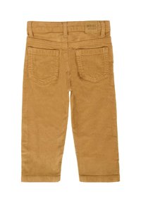 Pantaloni in corduroy color senape, con un classico design a cinque tasche, dettagli delle cuciture visibili e un'etichetta con il logo sulla vita.