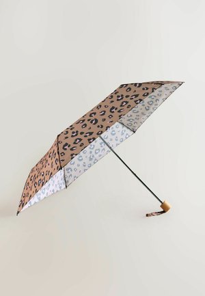 Leopard print umbrella with a beige and light blue color scheme, a black metal frame, and a wooden handle accent. Canopy features bold patterns.