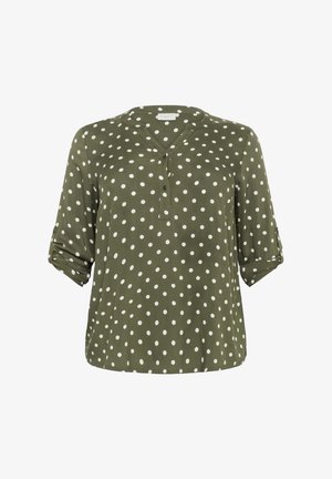 Oliwkowa bluzka w białe kropki, z dekoltem w kształcie litery V i zapięciem na guziki. Posiada podwinięte rękawy oraz gładką fakturę materiału.