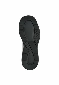Suela de zapato de goma negra con superficie texturada, que presenta patrones de tread circulares y en zigzag para mejorar el agarre y la tracción.