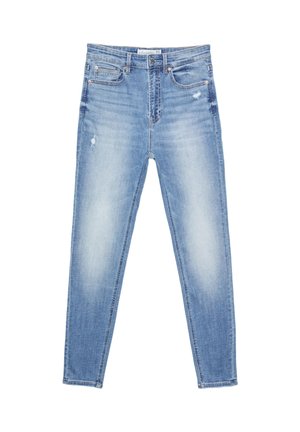 Jeans en denim bleu clair avec une coupe slim, un léger effet usé, un design à cinq poches et des détails cousus le long des coutures.
