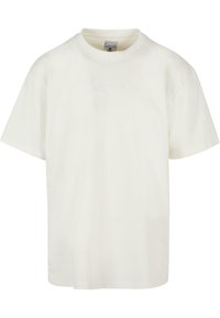 Trumpas rankovėmis, apvalia apykakle marškinėliai iš off-white medvilnės. Priekyje yra subtilus siuvinėtas logotipas. Atsipalaidavęs kirpimas, minkšta tekstūra.