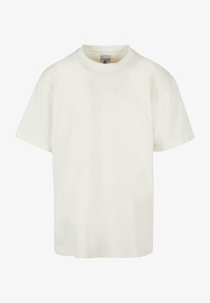 Kortærmet t-shirt med rund hals i off-white bomuld. Har en diskret broderet logo på forsiden. Løs pasform, blødt tekstur.