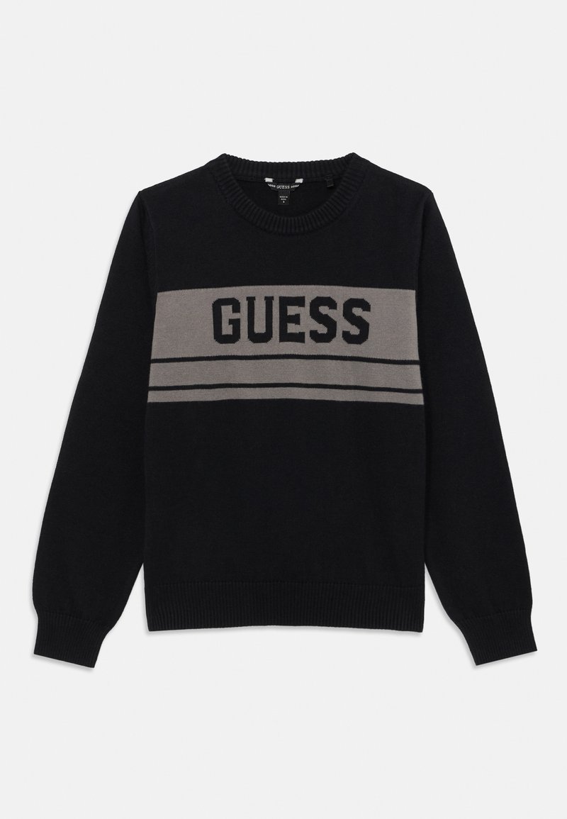 Pull noir à manches longues avec une bande horizontale grise et le texte « GUESS » sur la poitrine, col rond et poignets et ourlet côtelés.