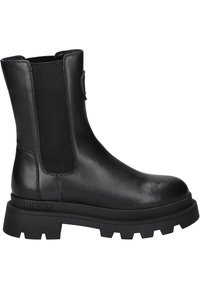 Botte mi-mollet en cuir noir avec semelle crantée épaisse, panneaux latéraux élastiques et bout rond, avec un détail de marque subtil sur la semelle.