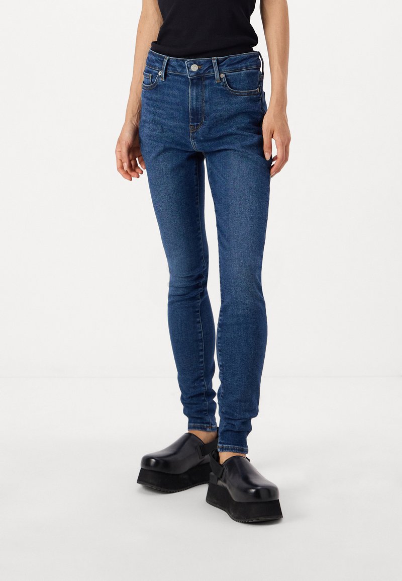 Tommy Hilfiger HARLEM SKINNY - Testhezálló fazon - dark blue denim