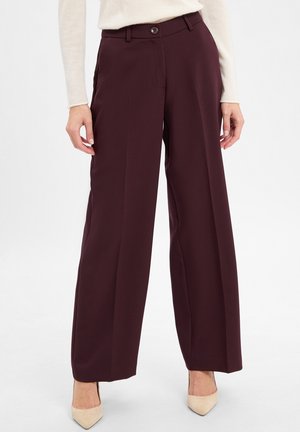 Burgundy wide-leg trousers made of smooth fabric, featuring a button closure, front pockets, and subtle creases for tailored fit.