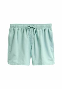Világoszöld fürdőshorts sima anyagból, elasztikus derékpánttal, zsinórral és oldalsó zsebekkel. Nincsenek látható minták.