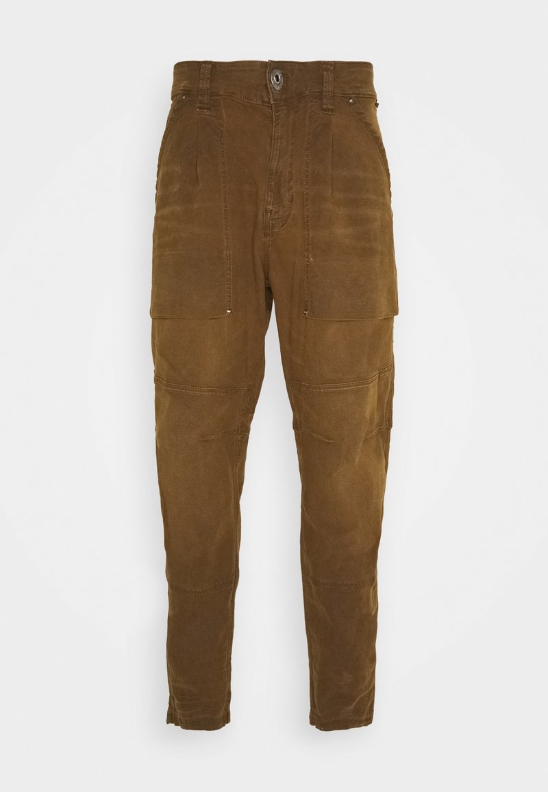 Brown cargo pants with a textured fabric, featuring two front pockets and a button closure. Includes visible stitching and a tapered leg design.