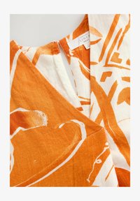 Unselected, orange tile print