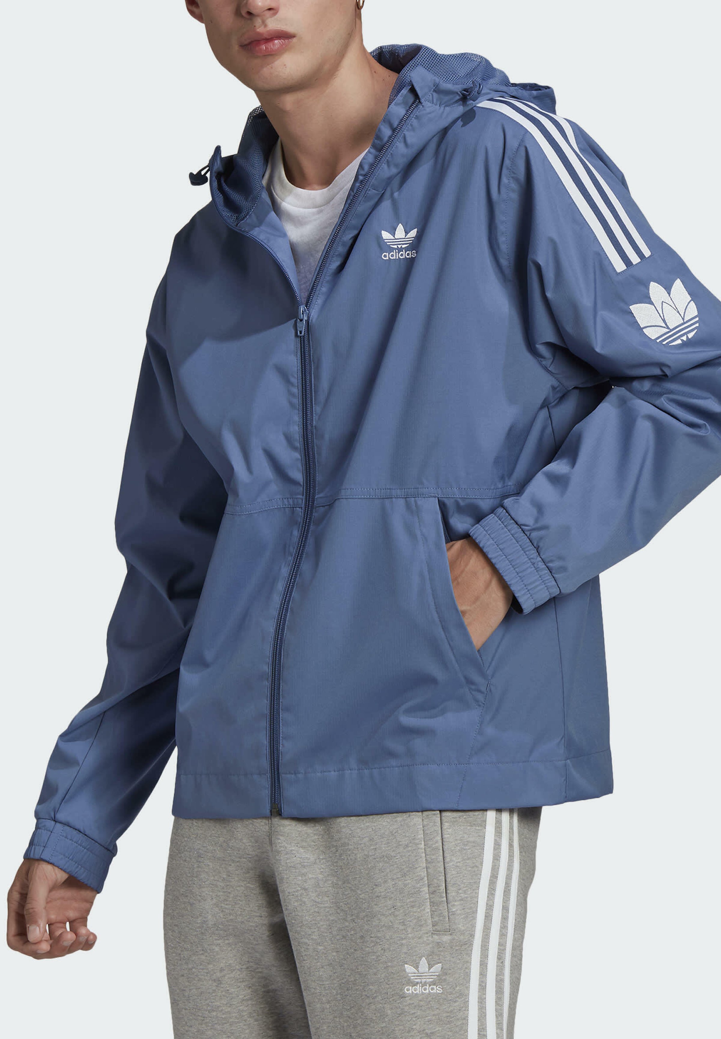 Adidas originals repeating trefoil windbreaker Clearance
