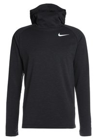 Sweat à capuche noir à manches longues en tissu texturé, présentant un col montant, des manches raglan, et un petit logo blanc Nike sur la poitrine.