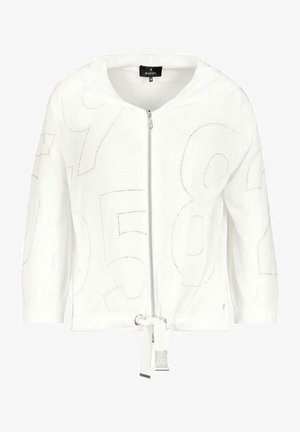 Valkoinen vetoketjullinen huppari, jossa on 3/4-hihat, kiristysnyörillä varustettu helma ja hillityt, suuret rei'itetyt numerokuviot edessä ja hihoissa.