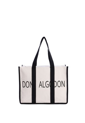 Bolsa tote rectangular blanca con asas y ribete negros, con texto negro parcialmente visible "DON ALG" en la parte delantera.