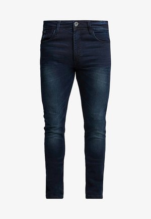 Slim-fit dark blue denim jeans with a smooth texture, five-pocket design, and subtle fading on the thighs, featuring a zip fly and button closure.